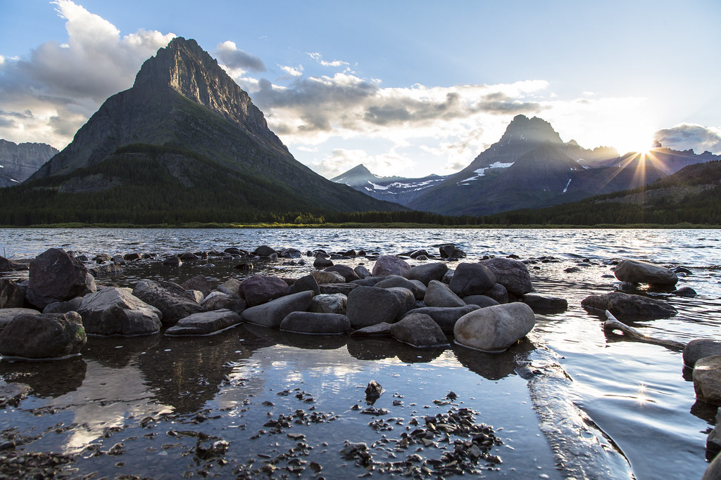 Sunset over the mountains and Swiftcurrent Lake in Glacier National Park
